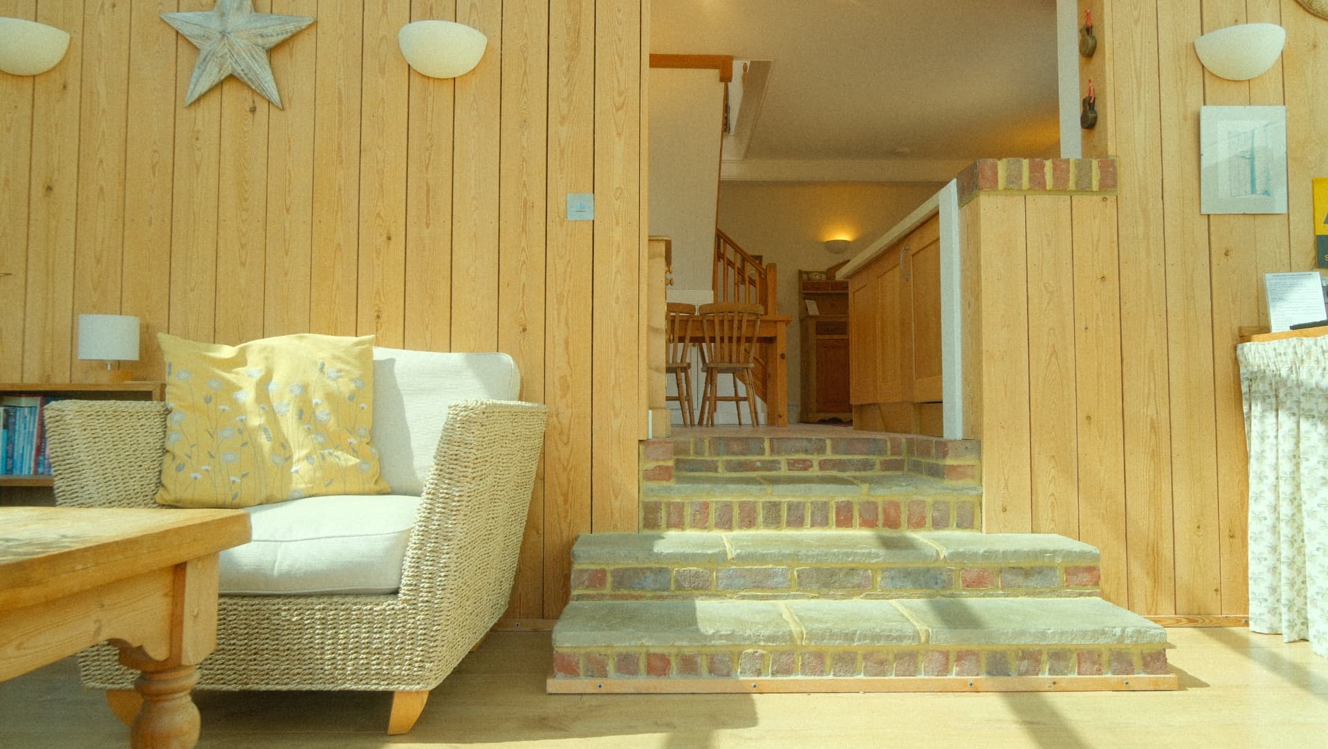 Brick steps up from the garden room to the dining area