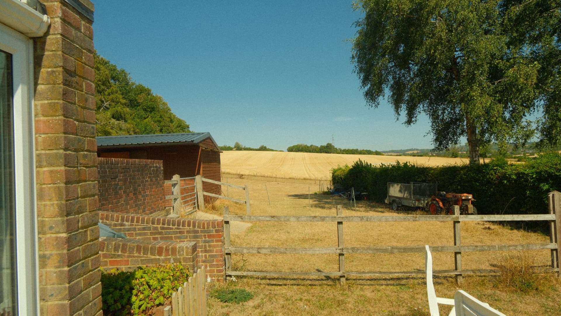 Looking out over the paddock and cornfield beyond