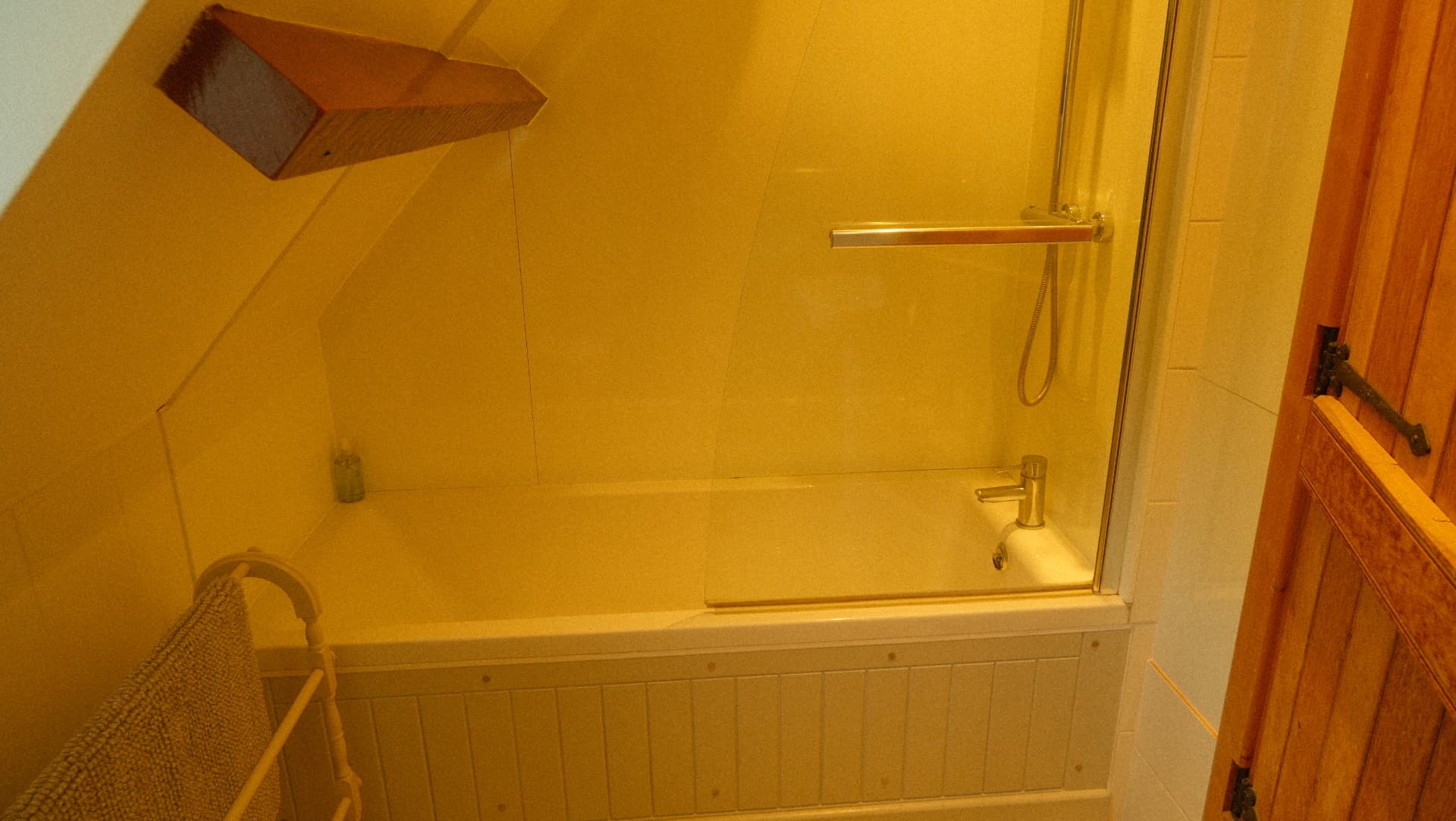 The bath with shower over