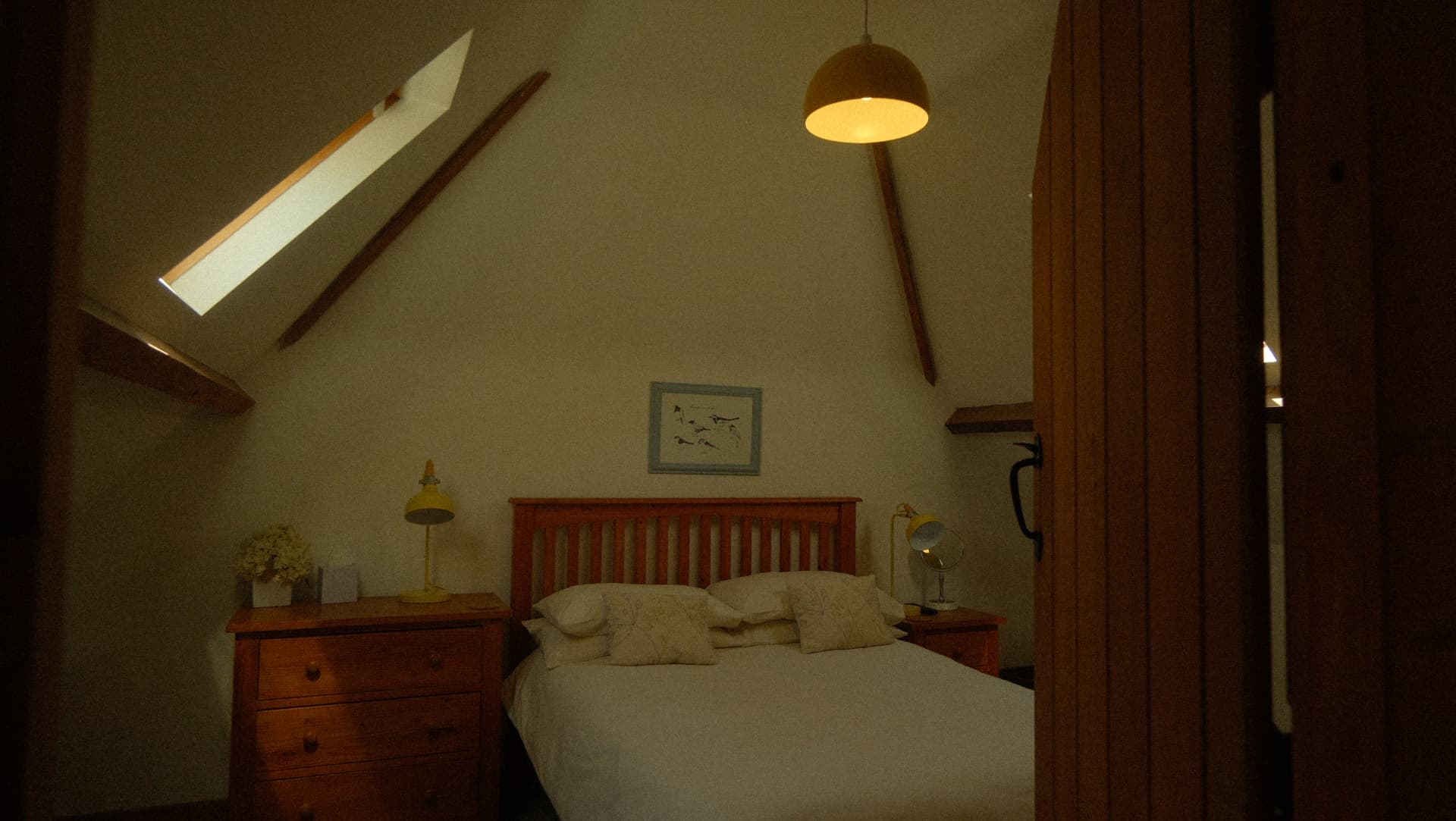 Bedside lamps and beams at the end of the day