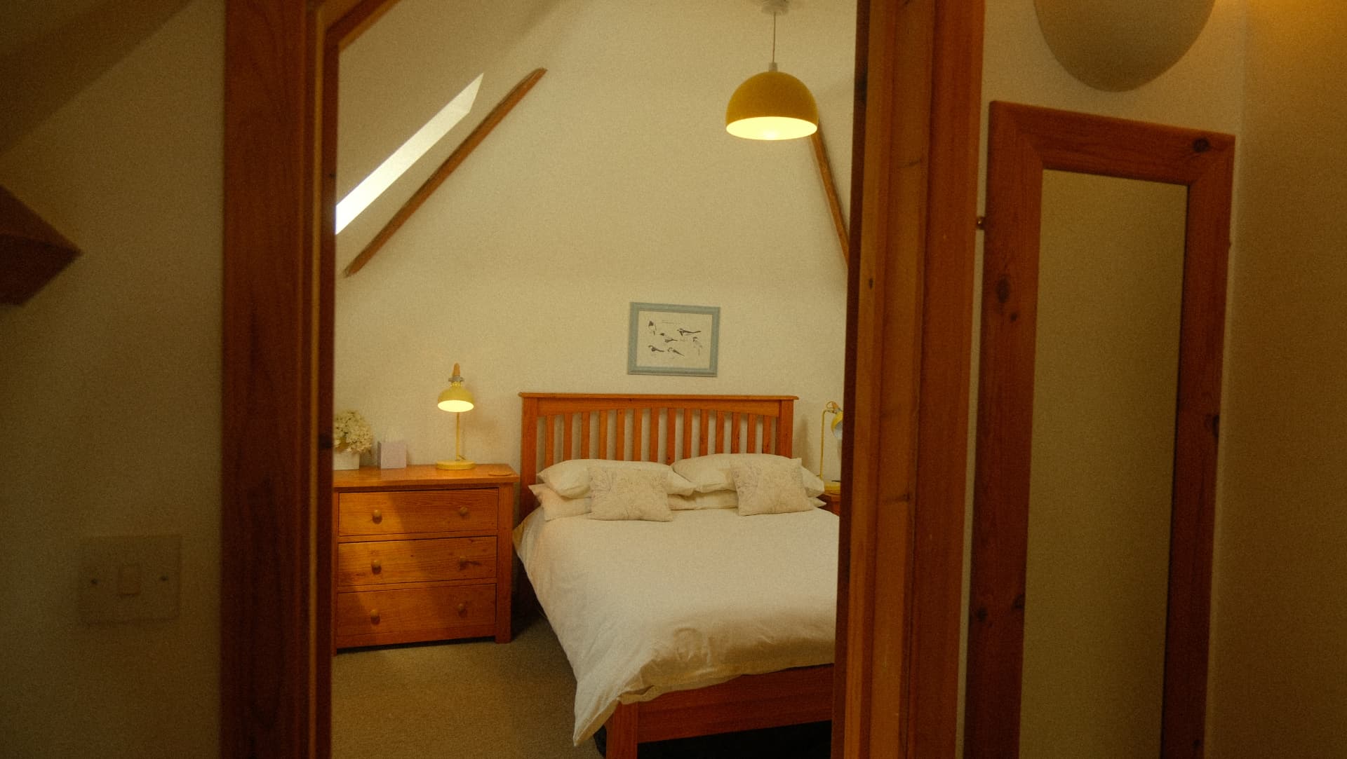 The beamed bedroom under the eaves