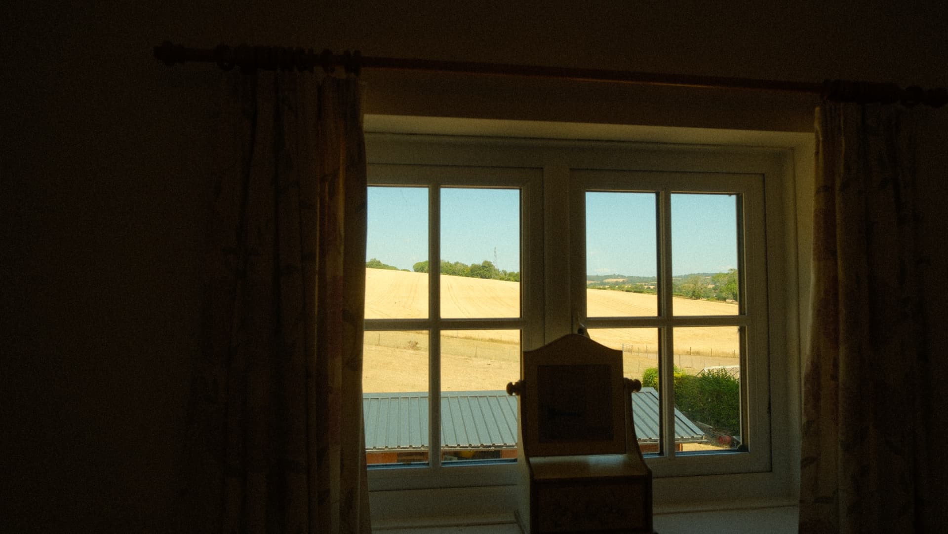 Looking out over the wheat field from the bedroom window