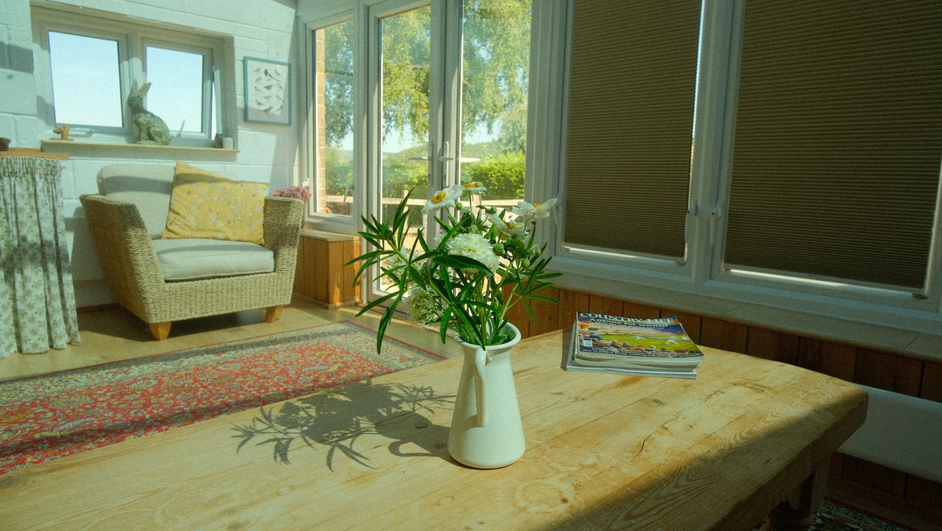 Wild flowers on the table, with the doors thrown open