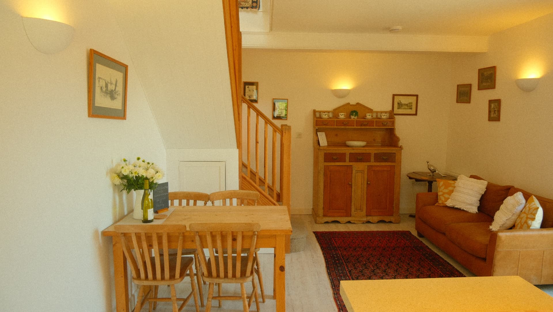 The dining table and sitting area, with the pine dresser
