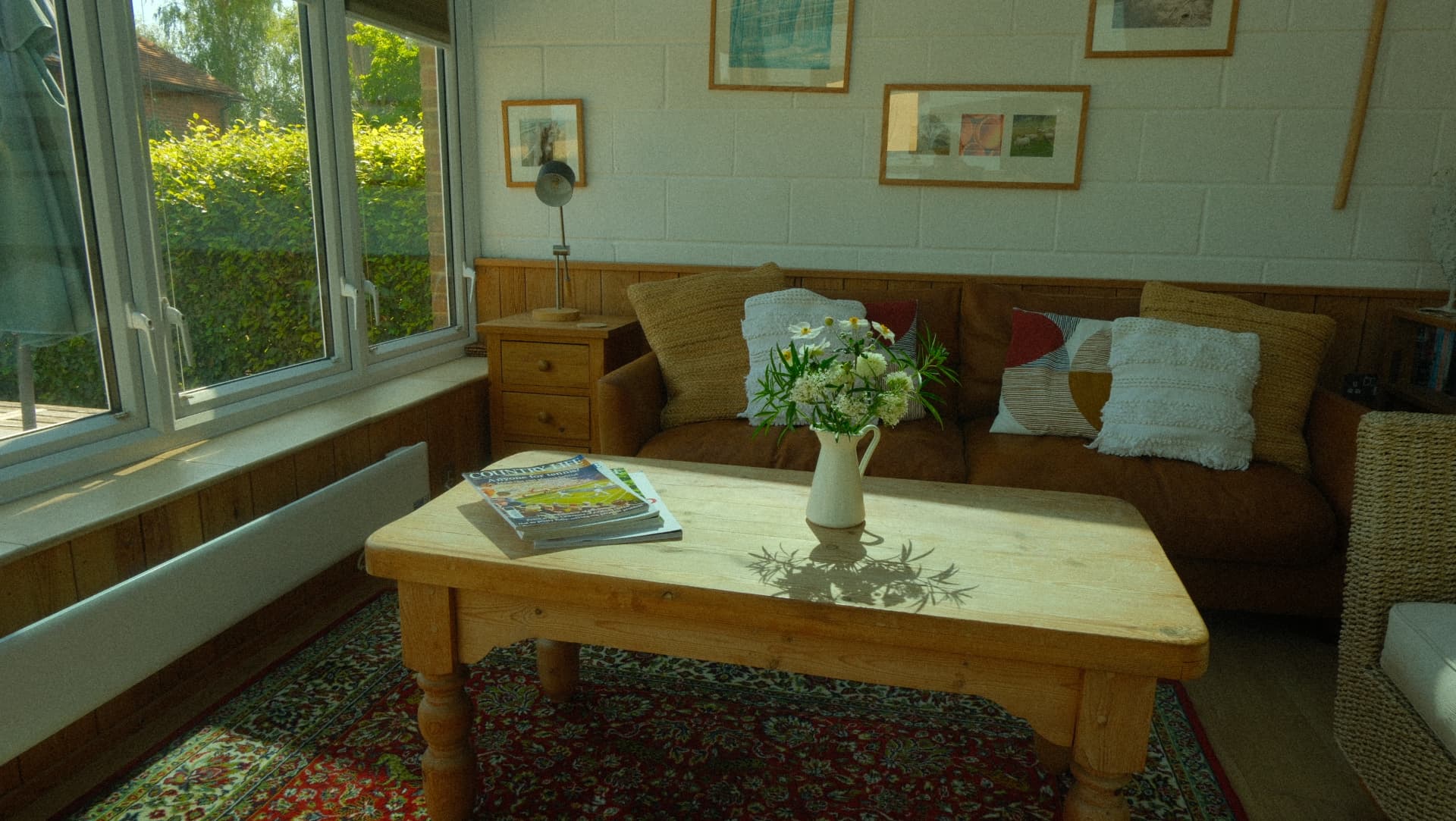 The garden room, looking out to the hedge and terrace