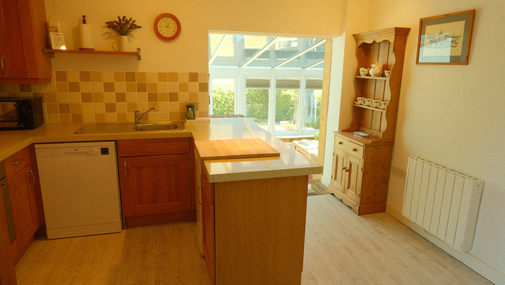 The kitchen, opening through to the conservatory