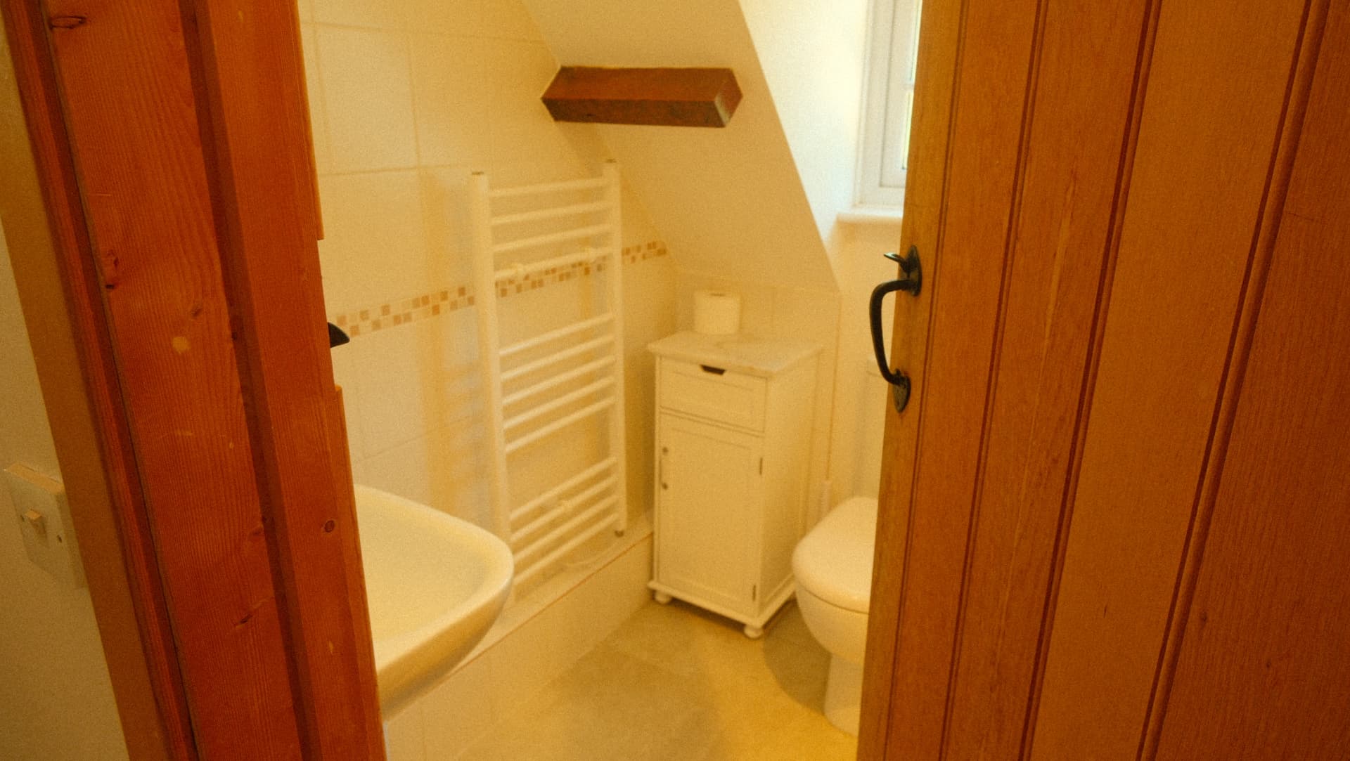 The bathroom, tiled and warm