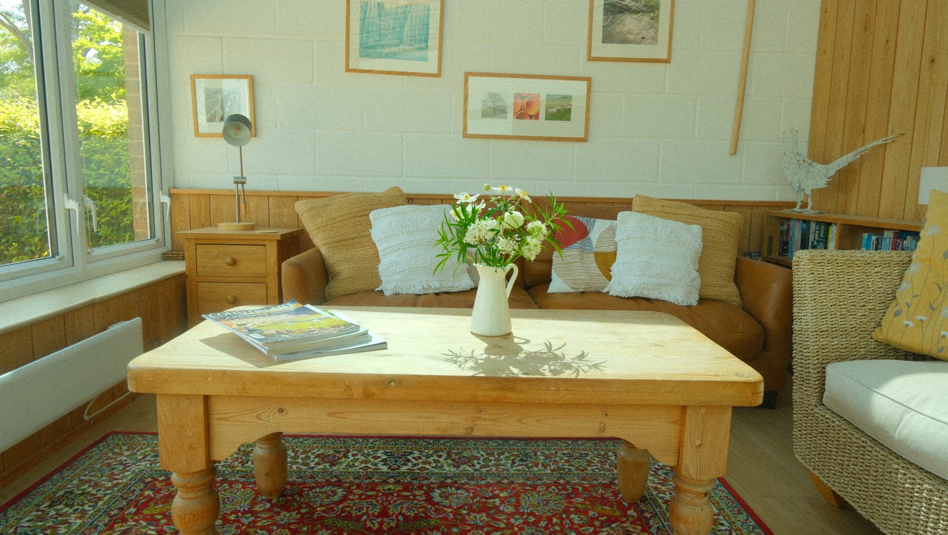 Sofas and a low pine table in the garden room