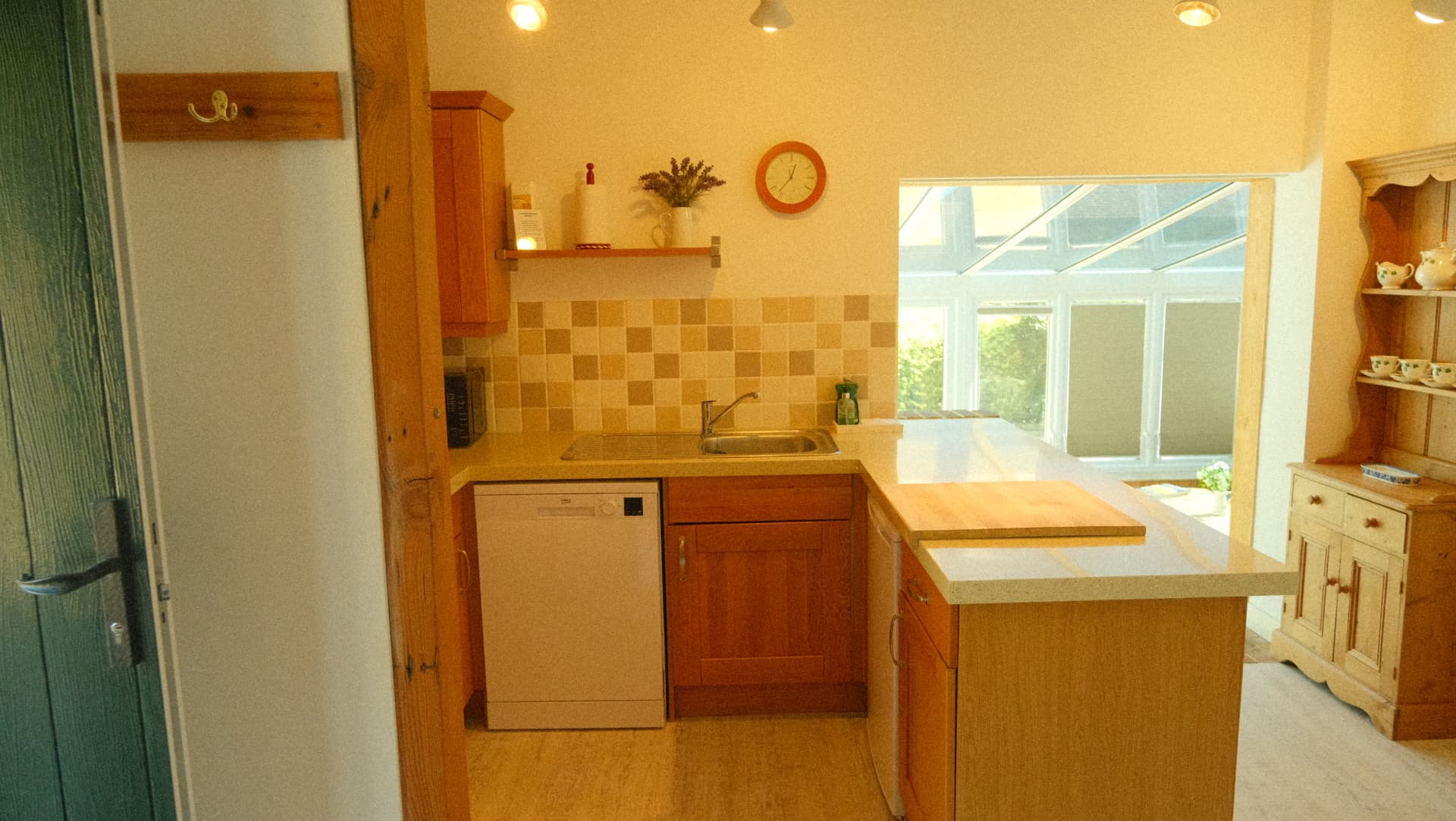 The kitchen, with dishwasher and view through to the conservatory